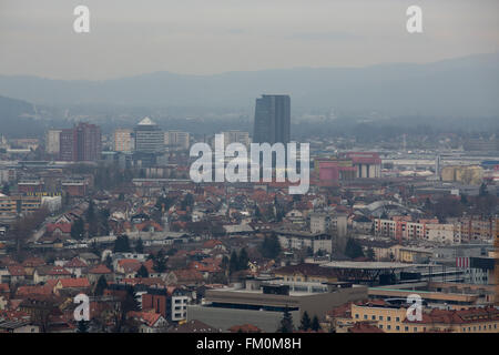 Buildings in Ljubljana, Slovenia. The city is shrouded in the light haze of winter fog. Stock Photo