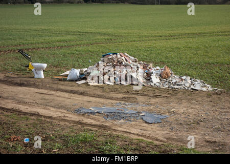Rubbish dumped by the side of a footpath in the English countryside near Dinnington, Rotherham. Stock Photo