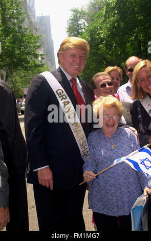 Real Estate mogul Donald Trump (L) is joined by Dr. Ruth Westheimer (R) on May 23, 2004 as he marches as Grand Marshal in the 40th annual Salute to Israel Parade on Fifth Ave. The theme of this year's parade was visiting Israel, an effort to revive the sagging economy in the country due to the ongoing Palestinian terrorism. (© Richard B. Levine) Stock Photo