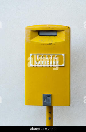 Yellow postbox of the Vatican Postal Servive in the center of Europe, Italy, Rome and Vatican Stock Photo