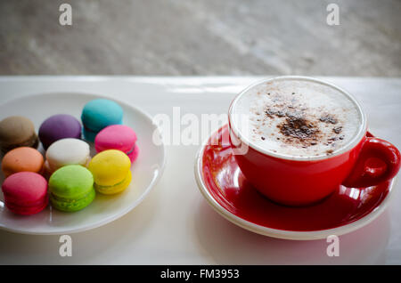 Cup of hot coffee and macaroons Stock Photo