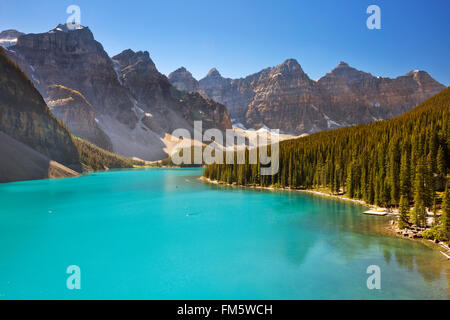 Moraine Lake in Banff National Park, Canada. Photographed on a beautiful sunny day with a clear blue sky. Stock Photo