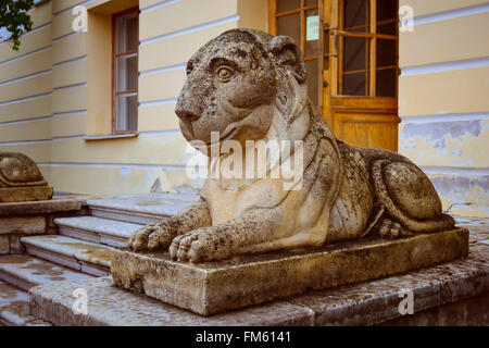 PAVLOVSK, RUSSIA - AUGUST 14, 2011: Sculpture of a reclining lion on the square at the Pavlovsk Palace in Pavlovsk, St Petersbur Stock Photo