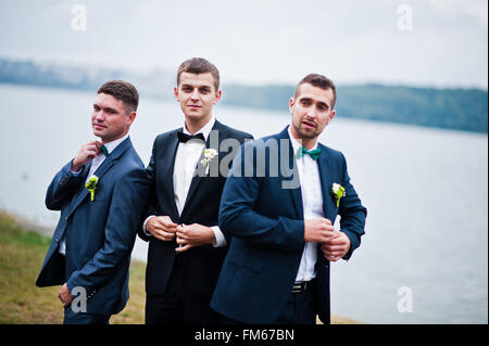 Three friends, groom with groomsman having fun Stock Photo