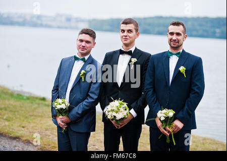 Three friends, groom with groomsman having fun Stock Photo
