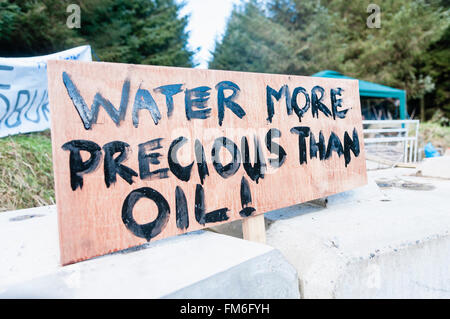 Sign at a oil drilling protest saying 'water more precious than oil!' Stock Photo