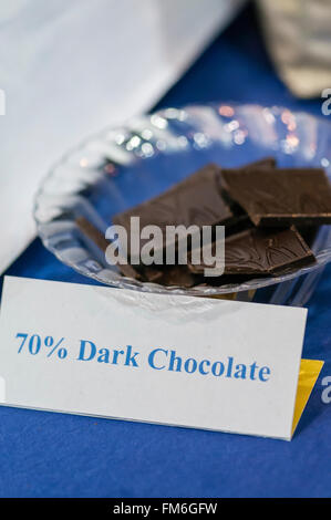 Samples of 70% dark chocolate squares. Stock Photo