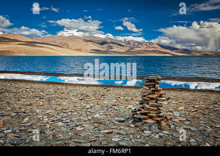 Stone cairn at Himalayan lake Tso Moriri Stock Photo