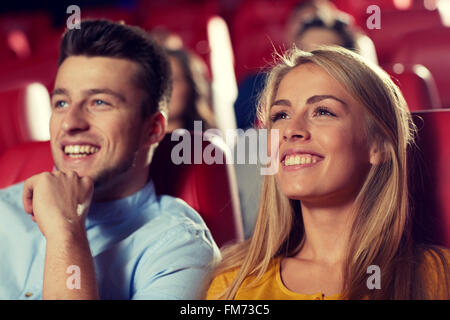 happy friends watching movie in theater Stock Photo