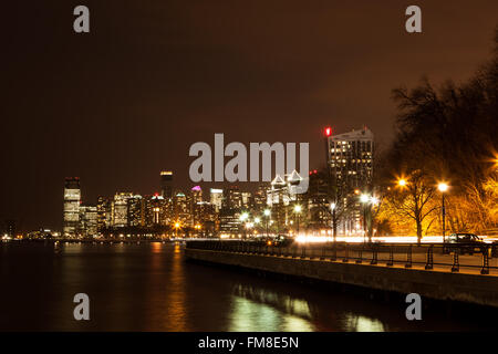 HOBOKEN, NEW JERSEY - MARCH 11: The Hoboken and Jersey City skylines are lit up at night. Photo taken on March 11, 2016. Stock Photo