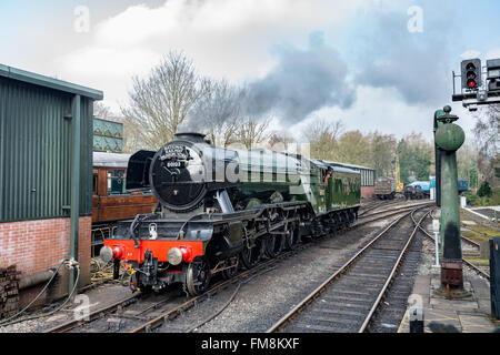 Pickering, North Yorkshire, 11th. March 2016. Hundreds of people turn out to greet the Flying Scotsman steam locomotive as it arrives in Pickering station. The North York Moors railway is the first heritage railway to have the famous loco after its 10 year £4.2-million-pound restoration. Stock Photo