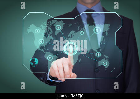 handsome businessman touching a world map on the screen showing global connection between different continents. Stock Photo