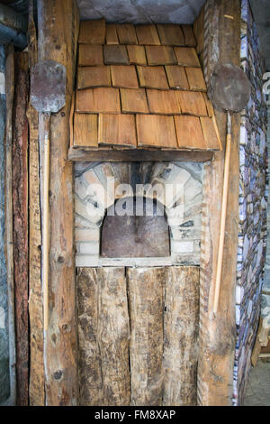 Detail of an outdoor wood-burning oven for baking bread. Stock Photo