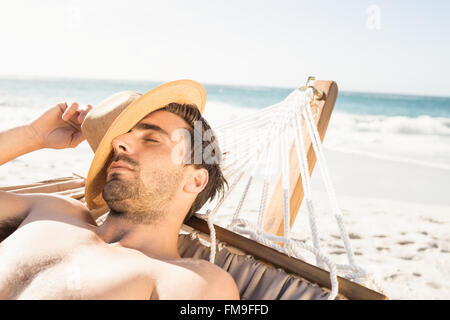 Man sleeping in hammock Stock Photo