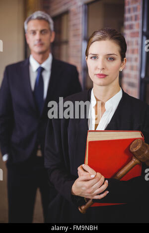 Female lawyer with male colleague in background Stock Photo