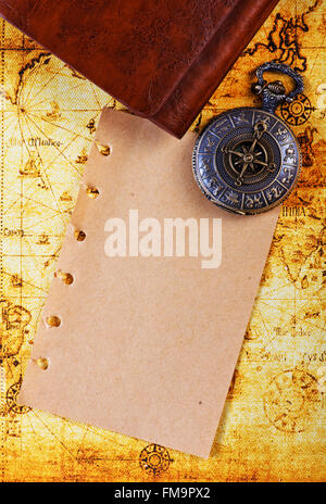 old notebook, loupe and compass on the map Stock Photo