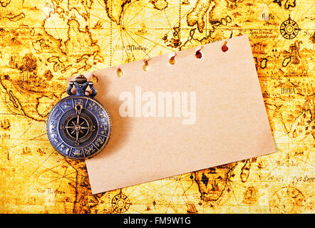 old notebook, loupe and compass on the map Stock Photo