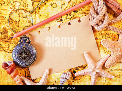 old notebook, loupe and compass on the map Stock Photo