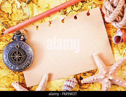 old notebook, loupe and compass on the map Stock Photo