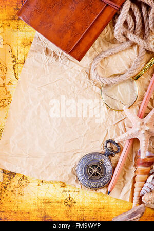 old notebook, loupe and compass on the map Stock Photo