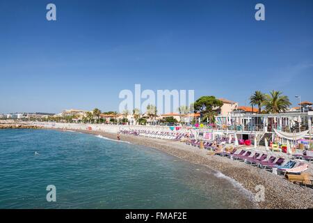 France, Alpes Maritimes, Cagnes sur Mer, sunbeds and parasols of the Art Beach Stock Photo