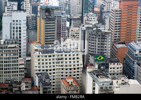 Brazilian flag in a sea of block buildings, Sao Paulo, Brazil Stock Photo