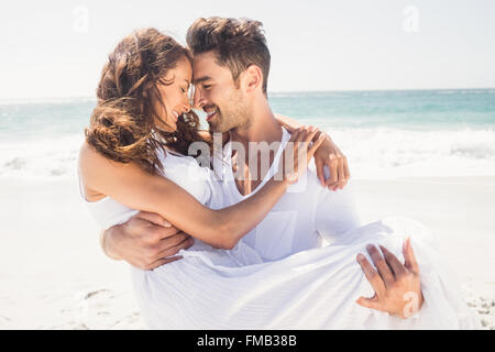 Boyfriend carrying his girlfriend Stock Photo
