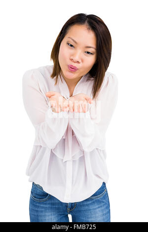 Young woman blowing a kiss Stock Photo