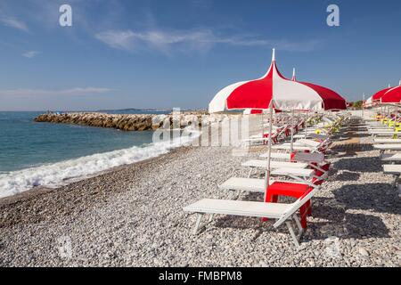 France, Alpes Maritimes, Cagnes sur Mer, sunbeds and parasols of the stone beach Stock Photo