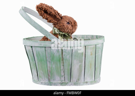 Easter bunny in old wooden basket Stock Photo