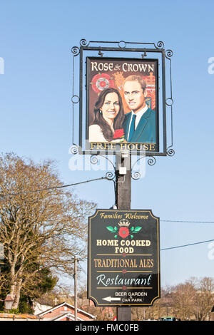 Kate and William painting on pub sign at Rose and Crown,Tilshead,Wiltshire,Salisbury Plain,England,U.K.,Europe. Stock Photo