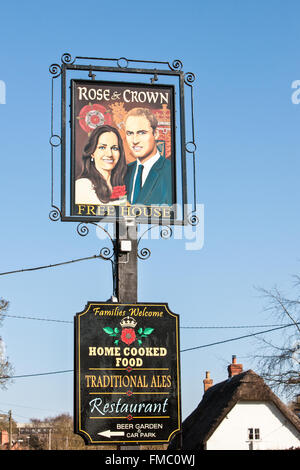 Kate and William painting on pub sign at Rose and Crown,Tilshead,Wiltshire,Salisbury Plain,England,U.K.,Europe. Stock Photo