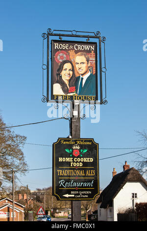 Kate and William painting on pub sign at Rose and Crown,Tilshead,Wiltshire,Salisbury Plain,England,U.K.,Europe. Stock Photo