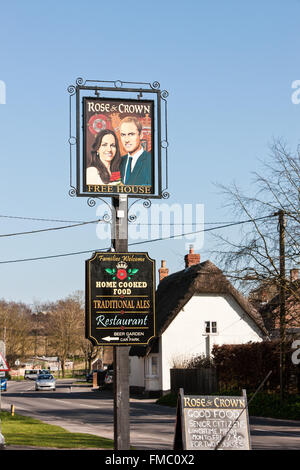 Kate and William painting on pub sign at Rose and Crown,Tilshead,Wiltshire,Salisbury Plain,England,U.K.,Europe. Stock Photo