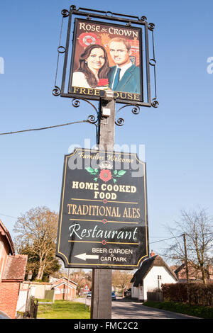 Kate and William painting on pub sign at Rose and Crown,Tilshead,Wiltshire,Salisbury Plain,England,U.K.,Europe. Stock Photo