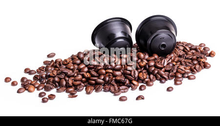 Coffee pods and beans isolated over white background Stock Photo