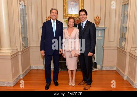 U.S. Secretary of State John Kerry poses for a photo with Canadian Prime Minister Justin Trudeau and First Lady Sophie Gregoire Trudeau at the State Department before a State Luncheon in their honor March 10, 2016 in Washington, DC. This is the first state visit by a Canadian Prime Minister in 20-years. Stock Photo