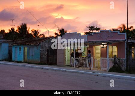 Cuba, Villa Clara, Caibarien, View of a street at dusk Stock Photo