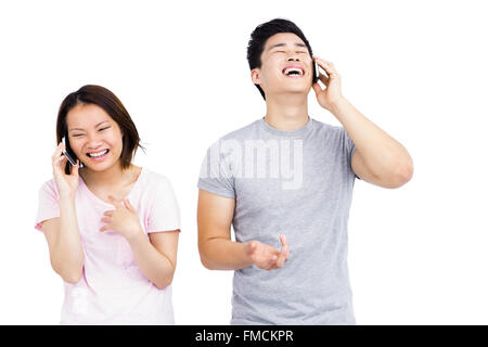 Young couple talking on mobile phone Stock Photo