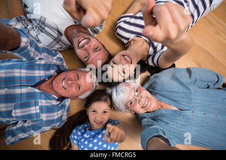 Happy family lying on floor Stock Photo