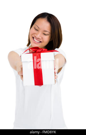 Happy woman holding gift box Stock Photo