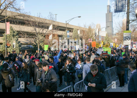 Chicago USA 11th March 2016. Thousands of people protesting a Donald Trump campaign rally  at the UIC Pavilion result in the postponement of the rally. While Mr. Trump claimed the rally was canceled upon the urging of the Chicago Police Department, it's since been revealed that Mr. Trump himself canceled the event. Credit:  Todd Bannor/Alamy Live News Stock Photo