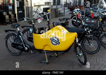 Black bikes rental, bicycle rental Amsterdam, Netherlands Stock Photo