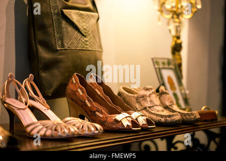 Vintage shoes for sale in a clothing store. Stock Photo