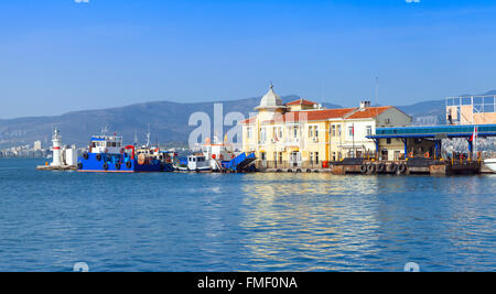 Coastal cityscape with Pasaport Dock and moored ships. Izmir city, Turkey Stock Photo