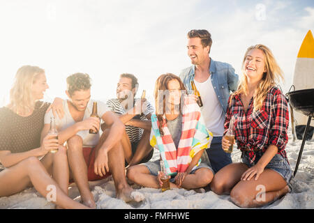 Happy friends having fun near barbecue Stock Photo - Alamy
