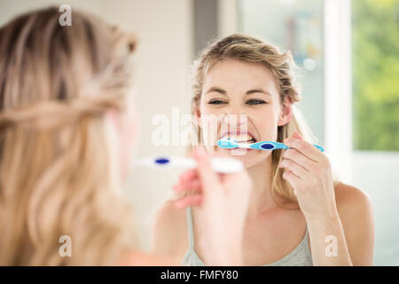 Woman brushing teeth Stock Photo