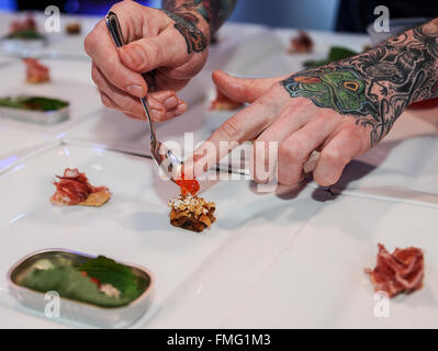 Los Angeles, USA. 11th Mar, 2016. A cook prepares food as six top chefs from across the United States present a delicacy dinner at American Masters Dinner night held during All-star Chef Classic Los Angeles in Los Angeles, the United States, on March 11, 2016. © Zhang Chaoqun/Xinhua/Alamy Live News Stock Photo