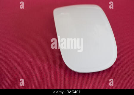 Wireless computer mouse on pink background, stock photo Stock Photo