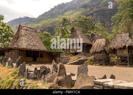 traditional high thatch-roofed houses, megalithes and shrines in the Ngada village Bena near Bajawa, Flores, Indonesia, Asia Stock Photo